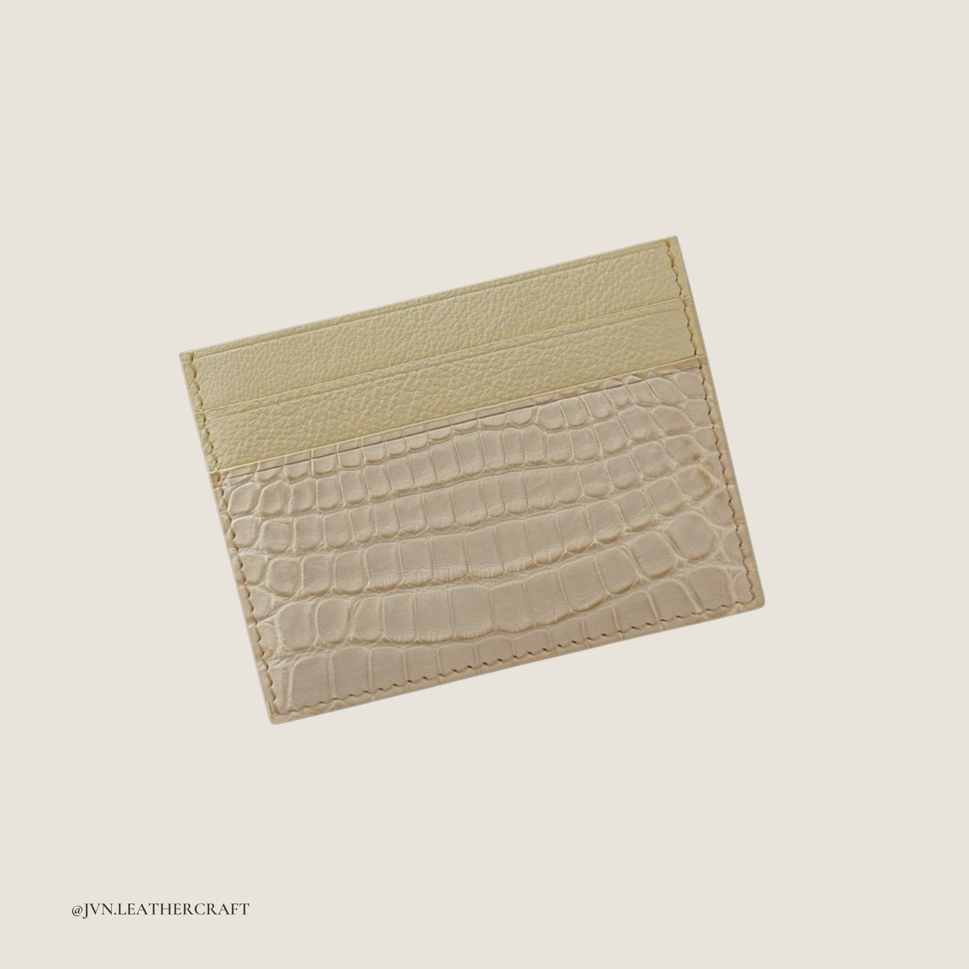 Two-tone leather cardholder with crocodile leather on a light beige background, branded 'JVN Leathercraft'.